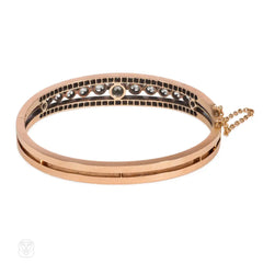 Antique graduated diamond and rose gold half-hoop bracelet