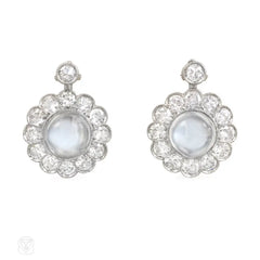 White gold, diamond, and moonstone cluster design earrings