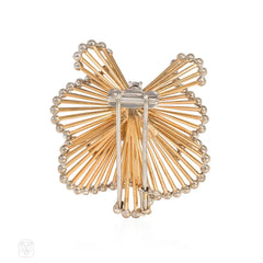 1950s Tiffany gold and diamond scroll brooch