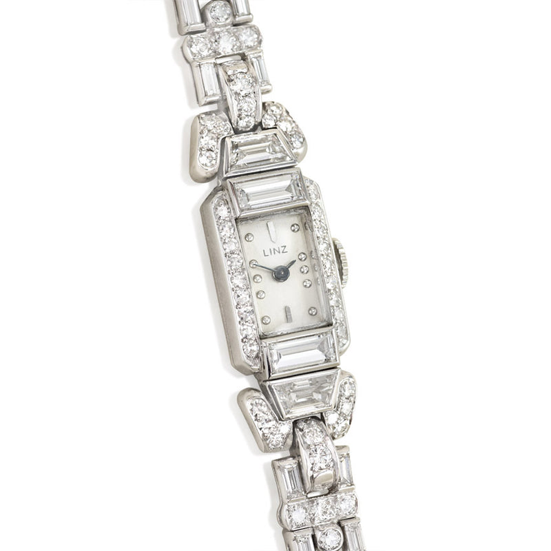 A diamond bracelet watch with geometric links, set with roun...