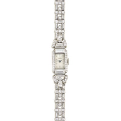 A diamond bracelet watch with geometric links, set with roun...