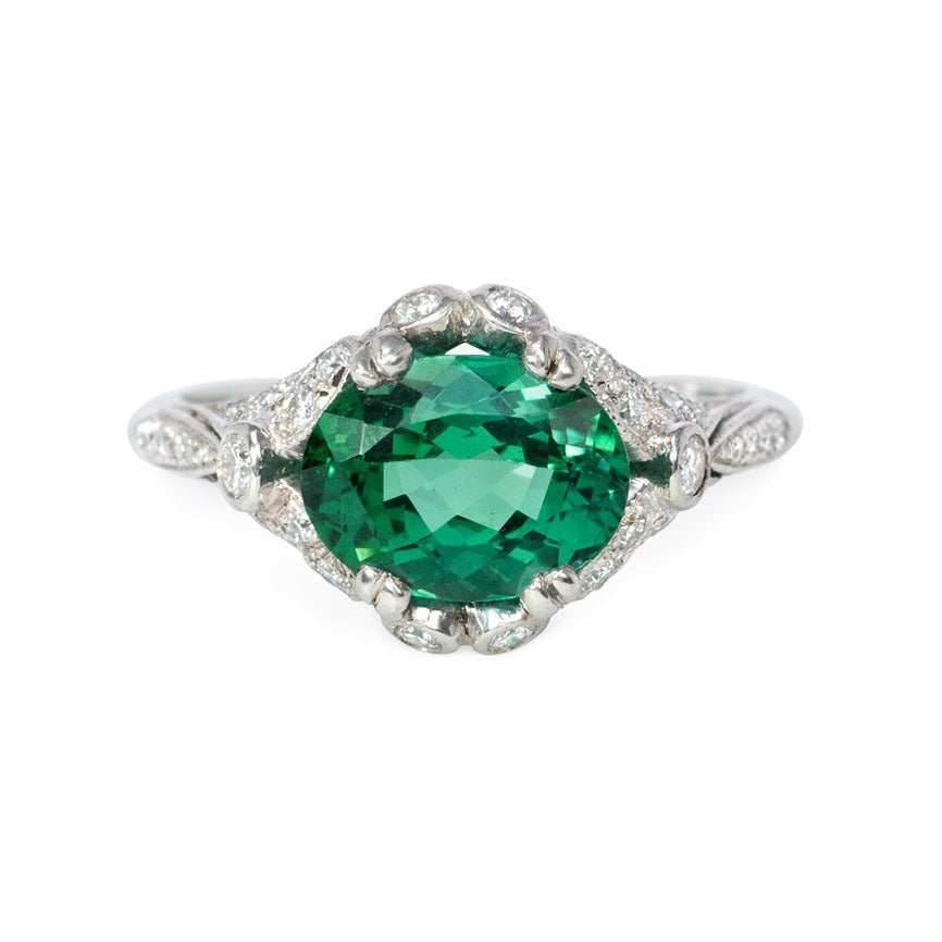 Green zircon solitaire ring with Edwardian style platinum band