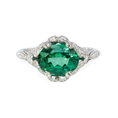 Green zircon solitaire ring with Edwardian style platinum band