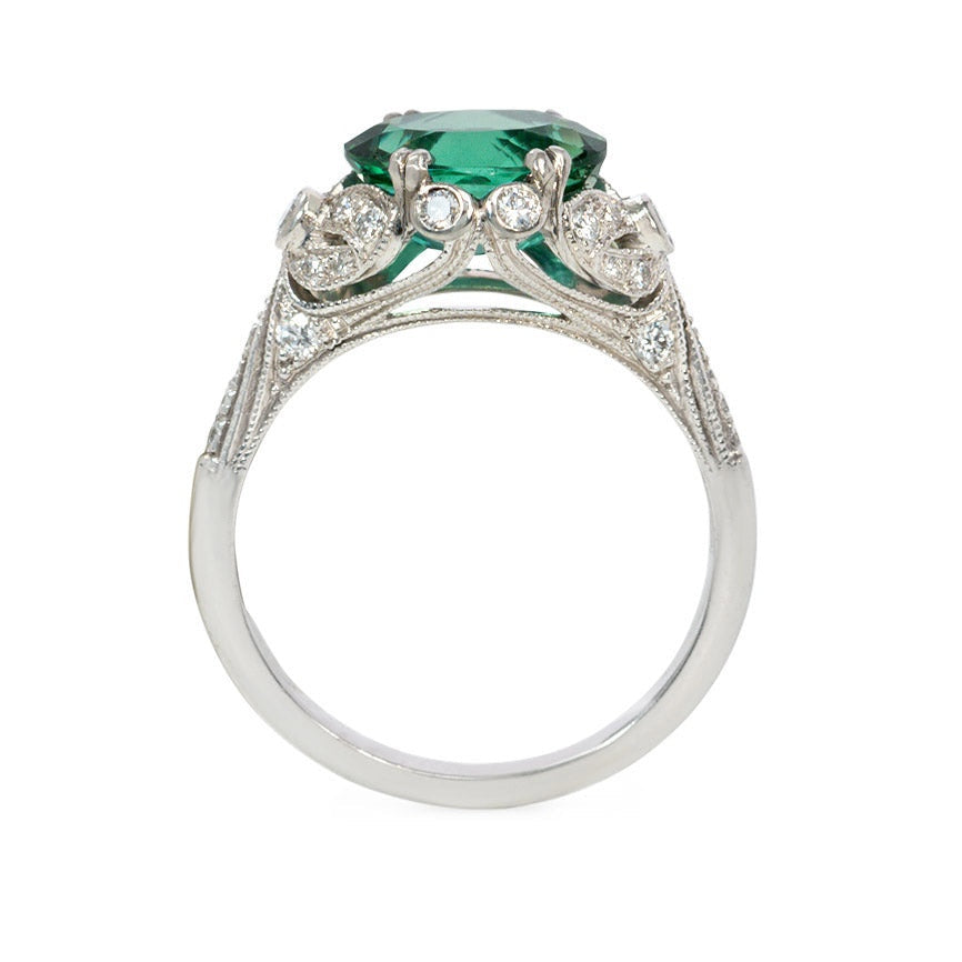 Green zircon solitaire ring with Edwardian style platinum band