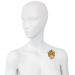 Gold and topaz brooch