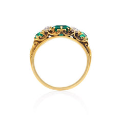 Antique gold ring set with emeralds and old mine diamonds