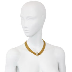 Gold chain mail necklace with diamond centerpiece