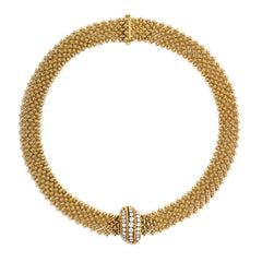 Gold chain mail necklace with diamond centerpiece