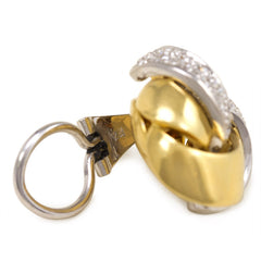 Two-color gold and diamond knot design earrings, Emil Meister