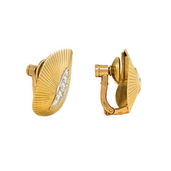 Gold and diamond stylized leaf earclips, Cartier Paris