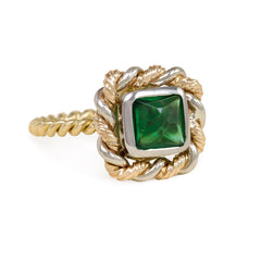 Emerald and mixed metal ring