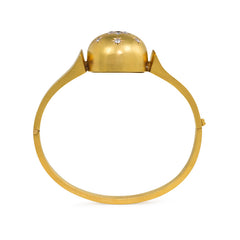 Antique gold bangle with central diamond and sapphire flower