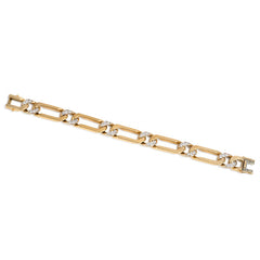 Gold and diamond curblink bracelet. Van Cleef & Arpels