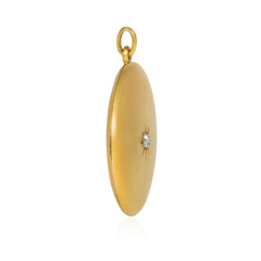 Antique round gold and diamond locket