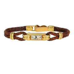 An Art Deco gold cocktail watch centered by a rectangular fa...