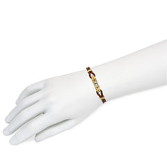 An Art Deco gold cocktail watch centered by a rectangular fa...