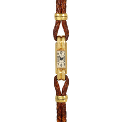 An Art Deco gold cocktail watch centered by a rectangular fa...