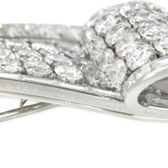 Cartier, Paris diamond and platinum graduated scroll brooch