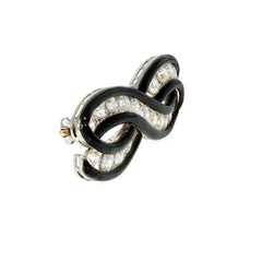 An Art Deco enamel and diamond infinity brooch
