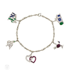 A diamond and gem-set charm bracelet