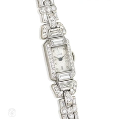 A diamond bracelet watch with geometric links, set with roun...