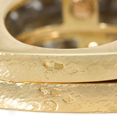 A pair of French gold, platinum, and diamond twist rings for Neiman Marcus