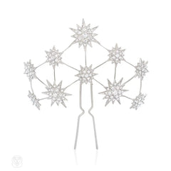 A Swarovski crystal hair slide of starburst motifs, in palladium-plated bronze.  Andrew Prince.