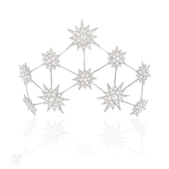 A Swarovski crystal hair slide of starburst motifs, in palladium-plated bronze.  Andrew Prince.