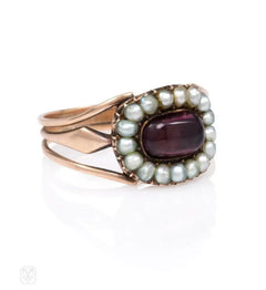 An antique half pearl and garnet cluster ring, in 18k.