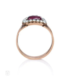 An antique half pearl and garnet cluster ring, in 18k.