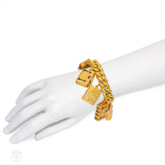 Antique gold charm bracelet with locket pendants