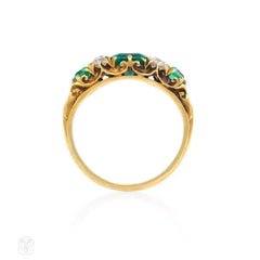 Antique gold ring set with emeralds and old mine diamonds