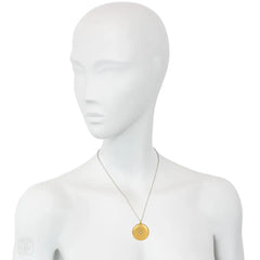 Antique round gold and diamond locket