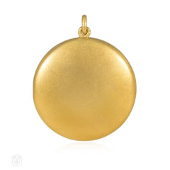 Antique round gold and diamond locket