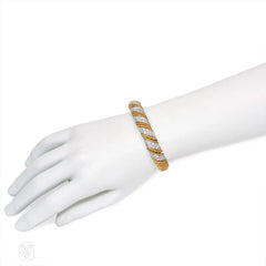 Articulated wrapped gold and diamond bracelet