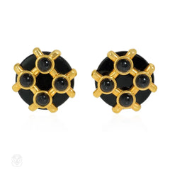 Cipullo for Cartier onyx and gold disc-shaped earrings.