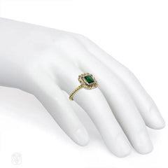Emerald and mixed metal ring