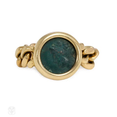 Flexible gold ring set with an ancient Greek coin. Bulgari.