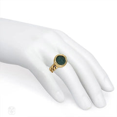 Flexible gold ring set with an ancient Greek coin. Bulgari.