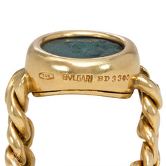Flexible gold ring set with an ancient Greek coin. Bulgari.