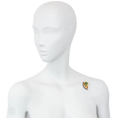 French Retro scroll brooch with sapphires and emerald