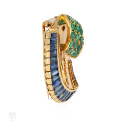 French Retro scroll brooch with sapphires and emerald