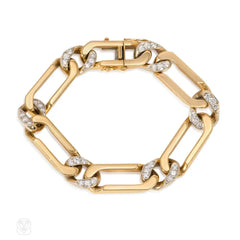 Gold and diamond curblink bracelet. Van Cleef & Arpels