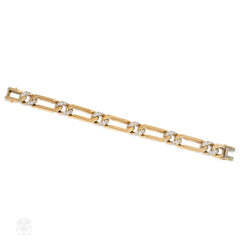 Gold and diamond curblink bracelet. Van Cleef & Arpels