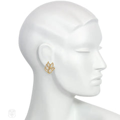 Gold and diamond earrings of overlapping leaf design
