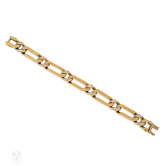 Gold and diamond elongated curblink bracelet. Van Cleef & Arpels