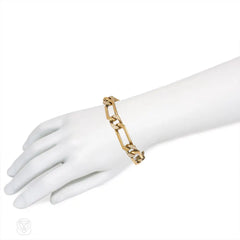 Gold and diamond elongated curblink bracelet. Van Cleef & Arpels