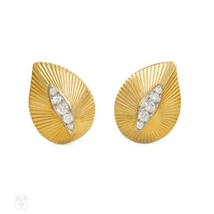 Gold and diamond stylized leaf earclips, Cartier Paris