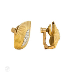 Gold and diamond stylized leaf earclips, Cartier Paris