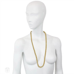 Gold bead necklace of adjustable length